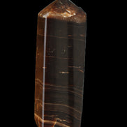 Chocolate Calcite obelisk 108*32mm 216g in sunlight - Rocks and Things Store