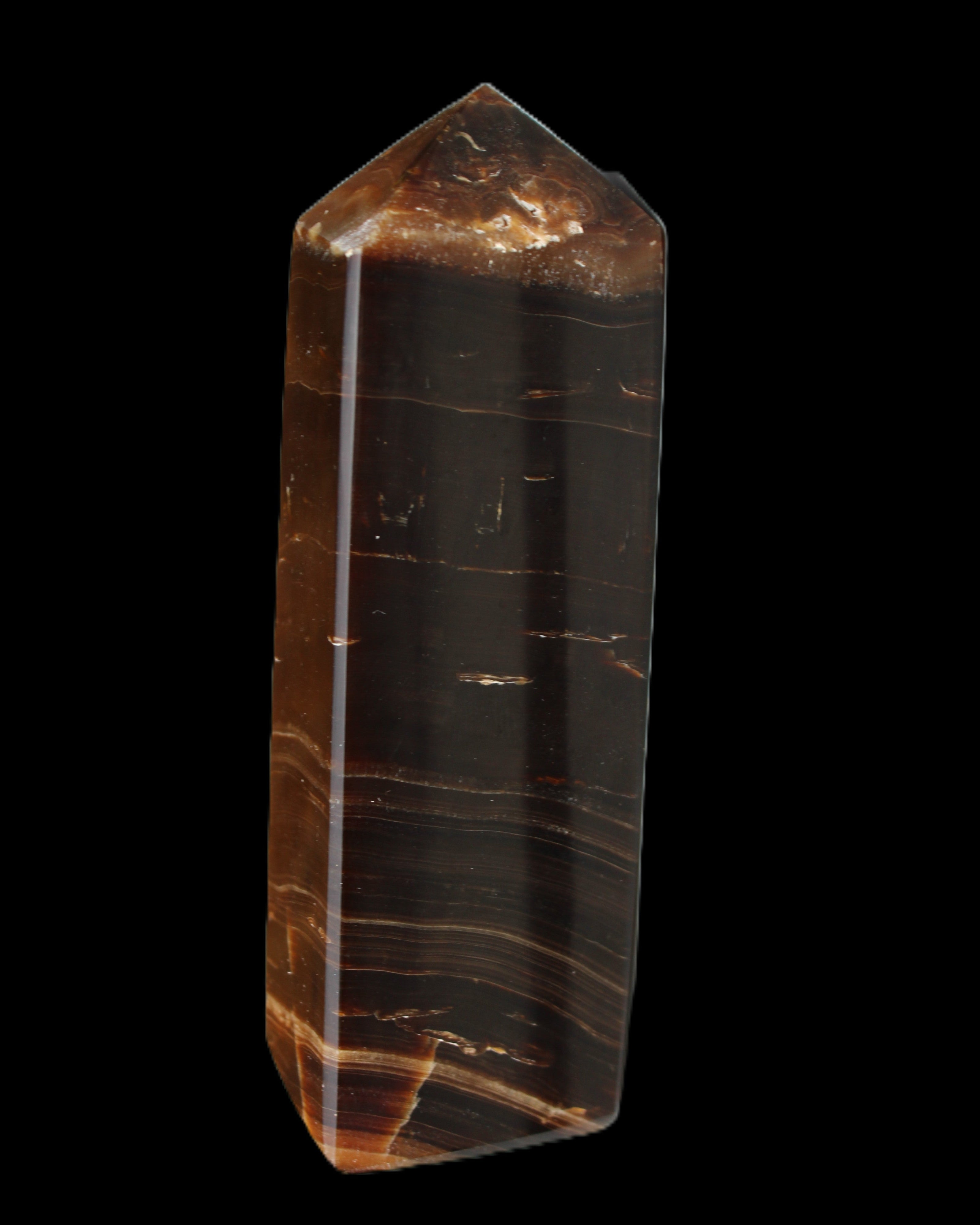 Chocolate Calcite obelisk 108*32mm 216g in sunlight - Rocks and Things Store