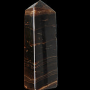 Chocolate Calcite obelisk 108*32mm 216g in sunlight - Rocks and Things Store