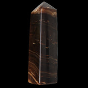 Chocolate Calcite obelisk 108*32mm 216g in sunlight - Rocks and Things Store