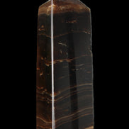 Chocolate Calcite obelisk 108*32mm 216g in sunlight - Rocks and Things Store
