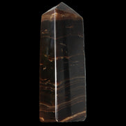 Chocolate Calcite obelisk 108*32mm 216g in sunlight - Rocks and Things Store