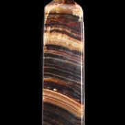 Chocolate Calcite obelisk 116*32mm 243g in sunlight - Rocks and Things Store