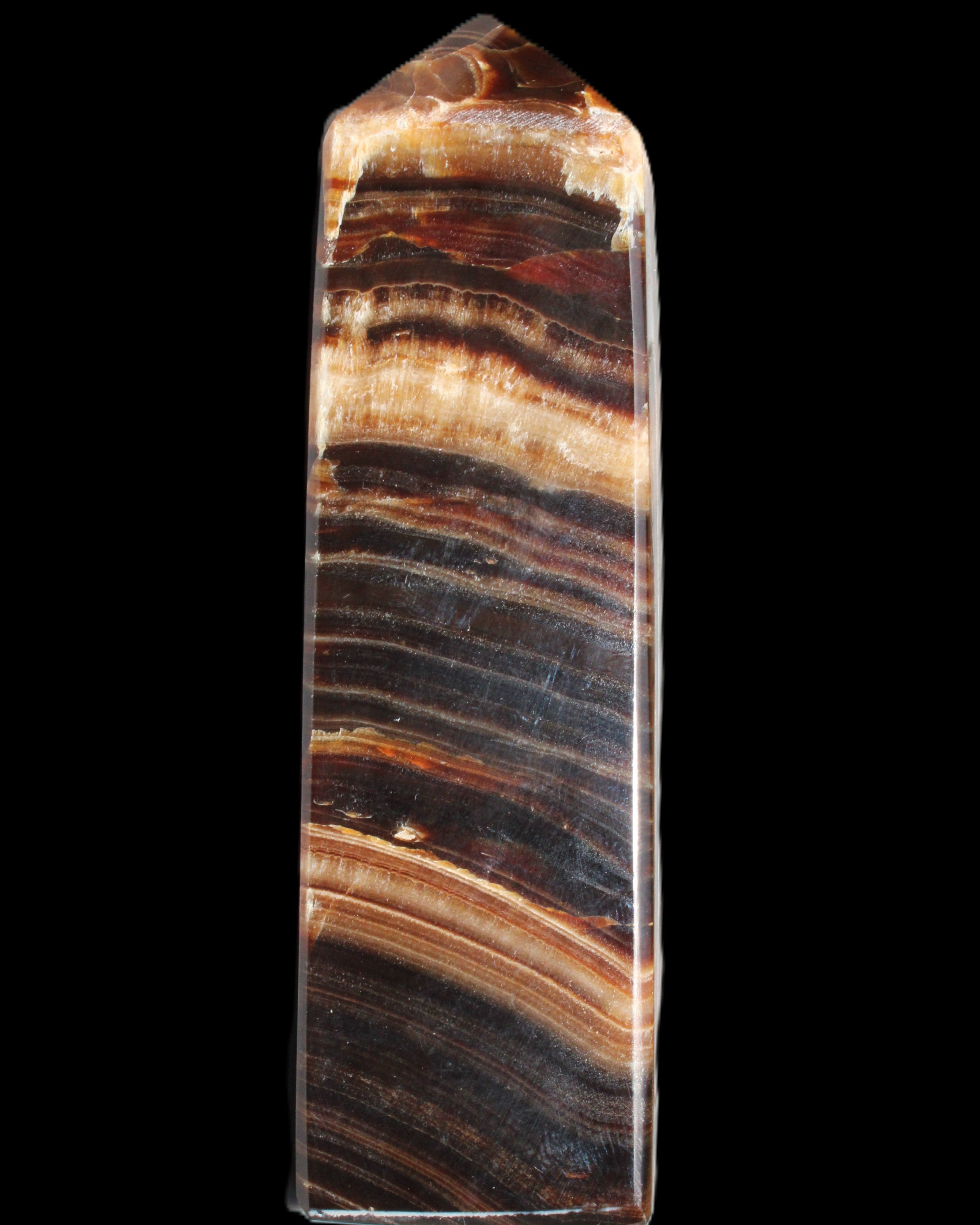 Chocolate Calcite obelisk 116*32mm 243g in sunlight - Rocks and Things Store
