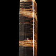 Chocolate Calcite obelisk 116*32mm 243g in sunlight - Rocks and Things Store