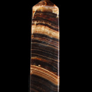 Chocolate Calcite obelisk 116*32mm 243g in sunlight - Rocks and Things Store