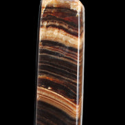 Chocolate Calcite obelisk 116*32mm 243g in sunlight - Rocks and Things Store