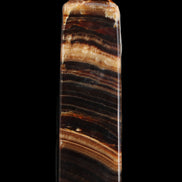 Chocolate Calcite obelisk 116*32mm 243g in sunlight - Rocks and Things Store