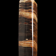 Chocolate Calcite obelisk 116*32mm 243g in sunlight - Rocks and Things Store