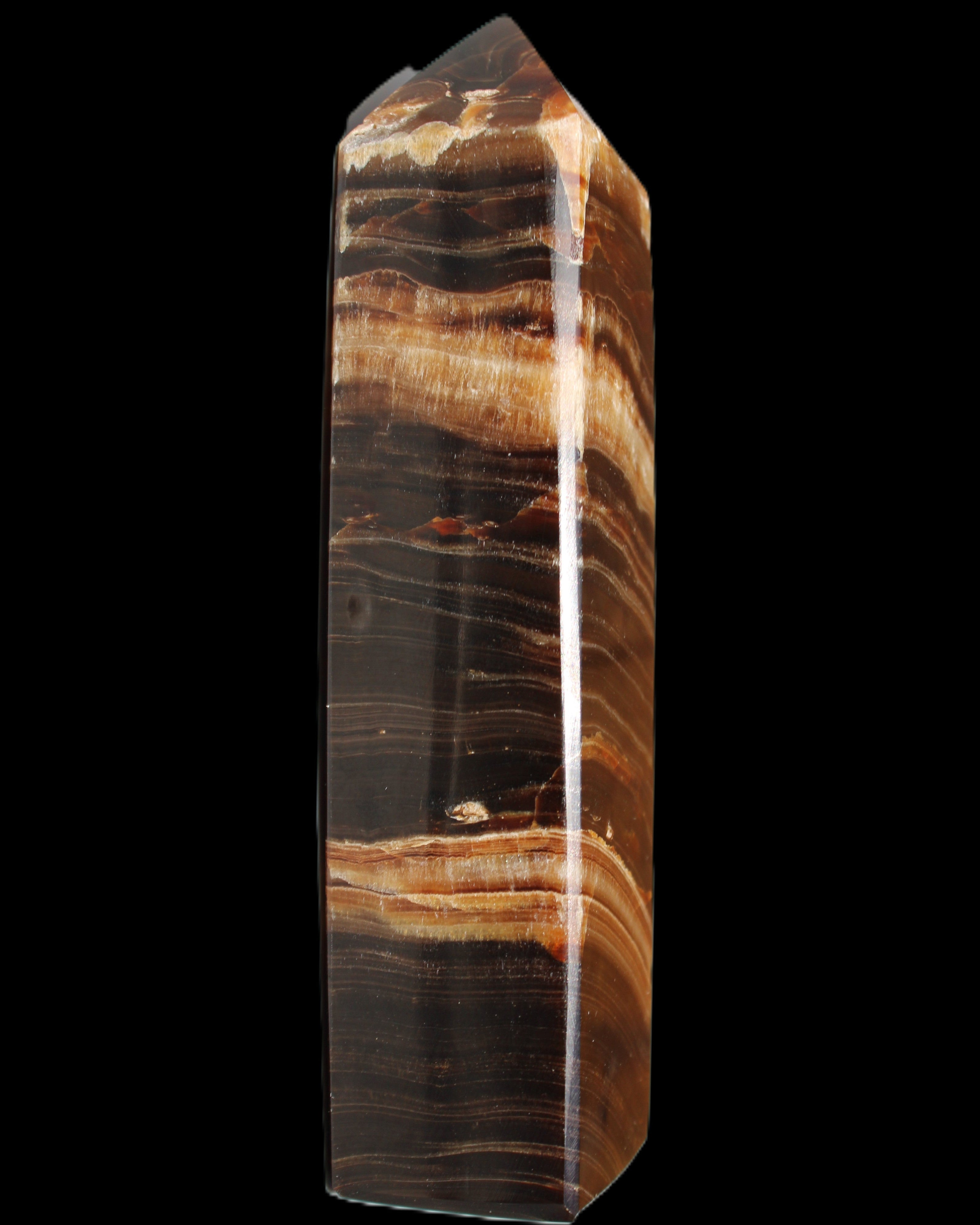 Chocolate Calcite obelisk 116*32mm 243g in sunlight - Rocks and Things Store