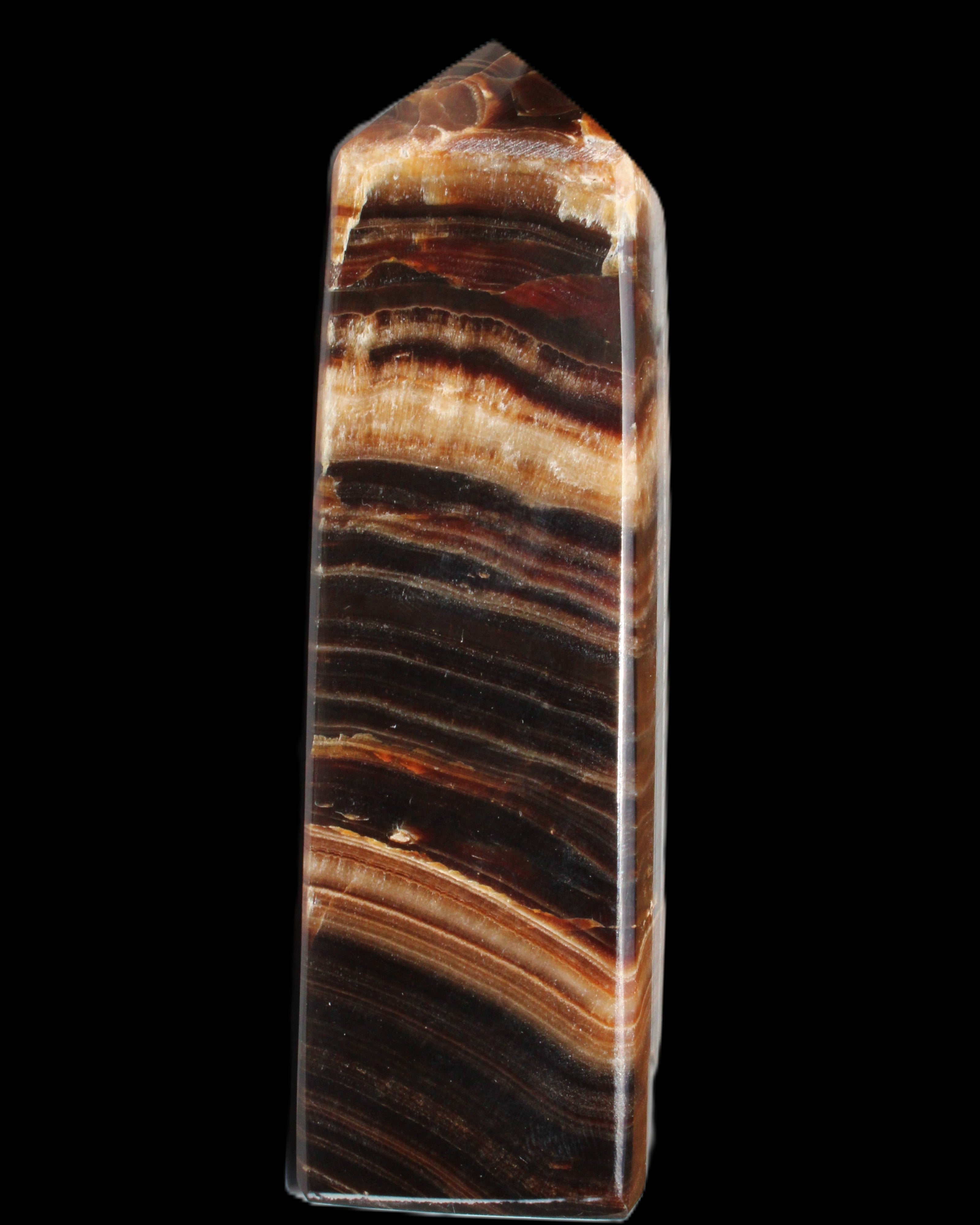Chocolate Calcite obelisk 116*32mm 243g in sunlight - Rocks and Things Store