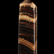 Chocolate Calcite obelisk 116*32mm 243g in sunlight - Rocks and Things Store