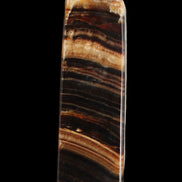 Chocolate Calcite obelisk 116*32mm 243g in sunlight - Rocks and Things Store