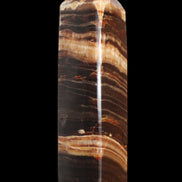 Chocolate Calcite obelisk 116*32mm 243g in sunlight - Rocks and Things Store