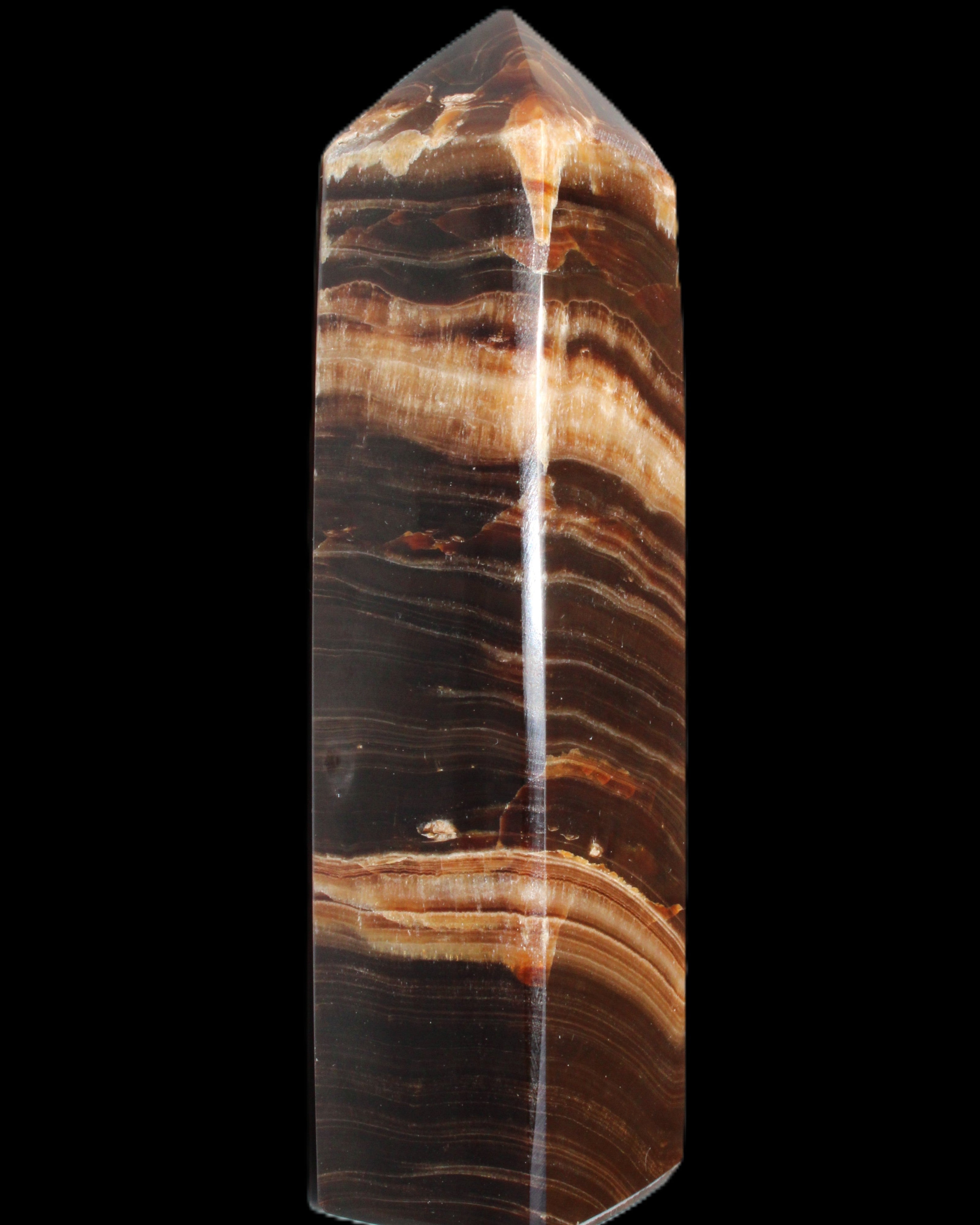 Chocolate Calcite obelisk 116*32mm 243g in sunlight - Rocks and Things Store