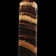 Chocolate Calcite obelisk 116*32mm 243g in sunlight - Rocks and Things Store