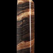 Chocolate Calcite obelisk 116*32mm 243g in sunlight - Rocks and Things Store