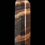 Chocolate Calcite obelisk 116*32mm 243g in sunlight - Rocks and Things Store