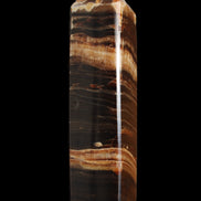 Chocolate Calcite obelisk 116*32mm 243g in sunlight - Rocks and Things Store