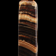 Chocolate Calcite obelisk 116*32mm 243g in sunlight - Rocks and Things Store