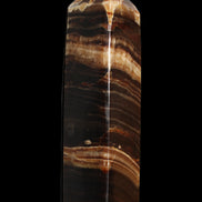 Chocolate Calcite obelisk 116*32mm 243g in sunlight - Rocks and Things Store