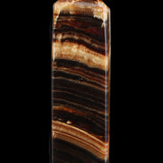 Chocolate Calcite obelisk 116*32mm 243g in sunlight - Rocks and Things Store
