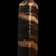 Chocolate Calcite obelisk 116*32mm 243g in sunlight - Rocks and Things Store
