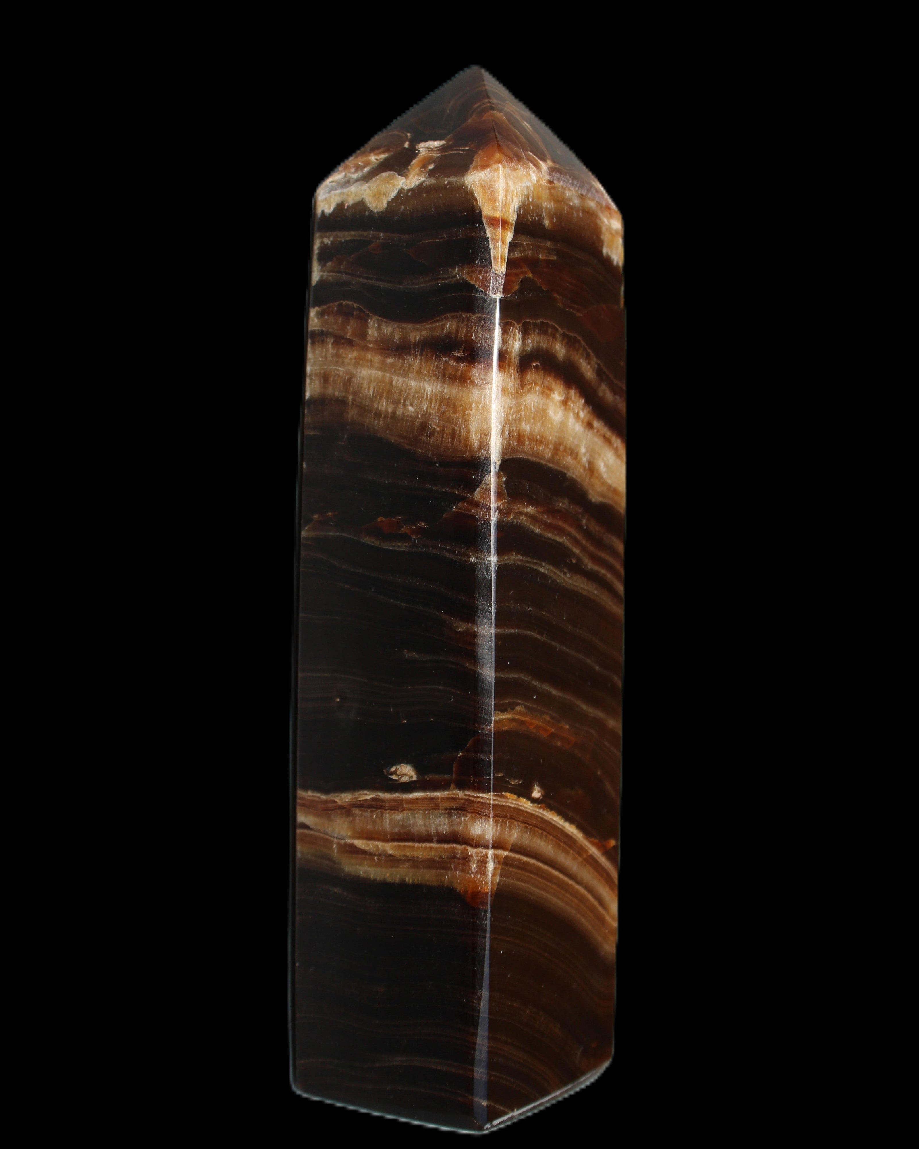 Chocolate Calcite obelisk 116*32mm 243g in sunlight - Rocks and Things Store