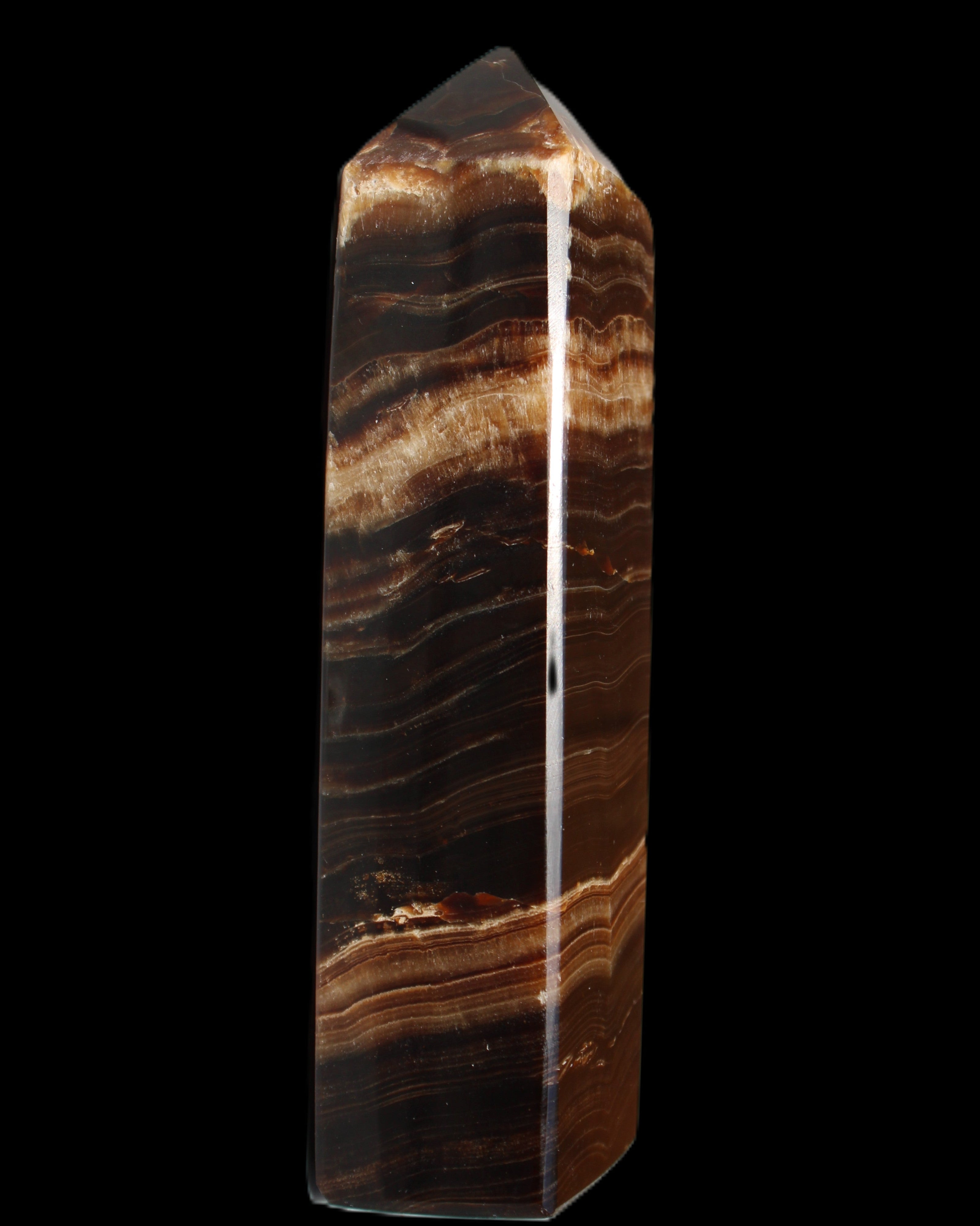 Chocolate Calcite obelisk 116*32mm 243g in sunlight - Rocks and Things Store