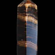 Chocolate Calcite obelisk 116*32mm 243g in sunlight - Rocks and Things Store