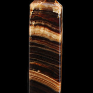 Chocolate Calcite obelisk 116*32mm 243g in sunlight - Rocks and Things Store