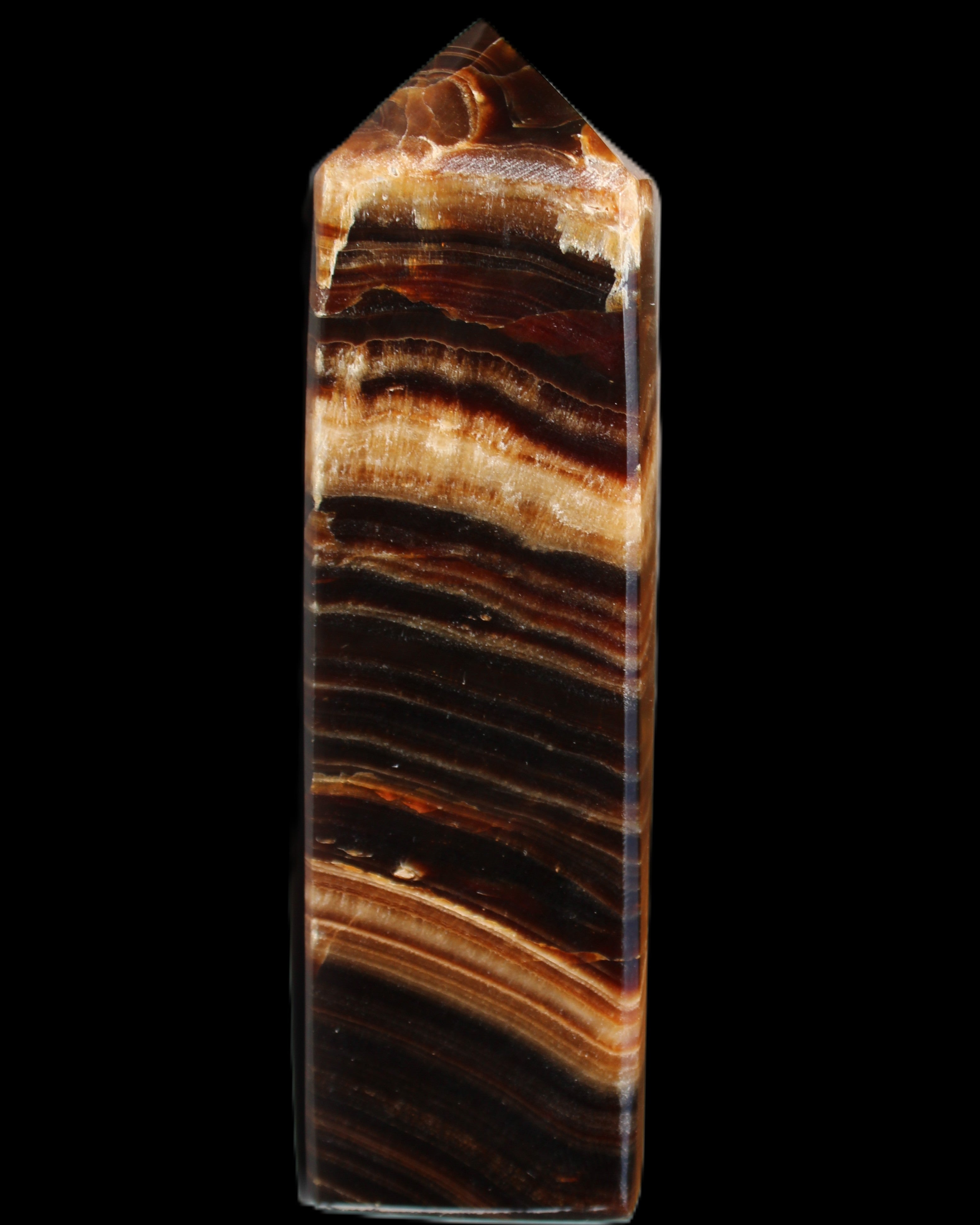 Chocolate Calcite obelisk 116*32mm 243g in sunlight - Rocks and Things Store