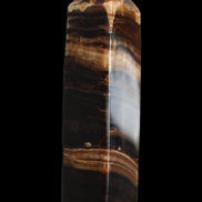 Chocolate Calcite obelisk 116*32mm 243g in sunlight - Rocks and Things Store