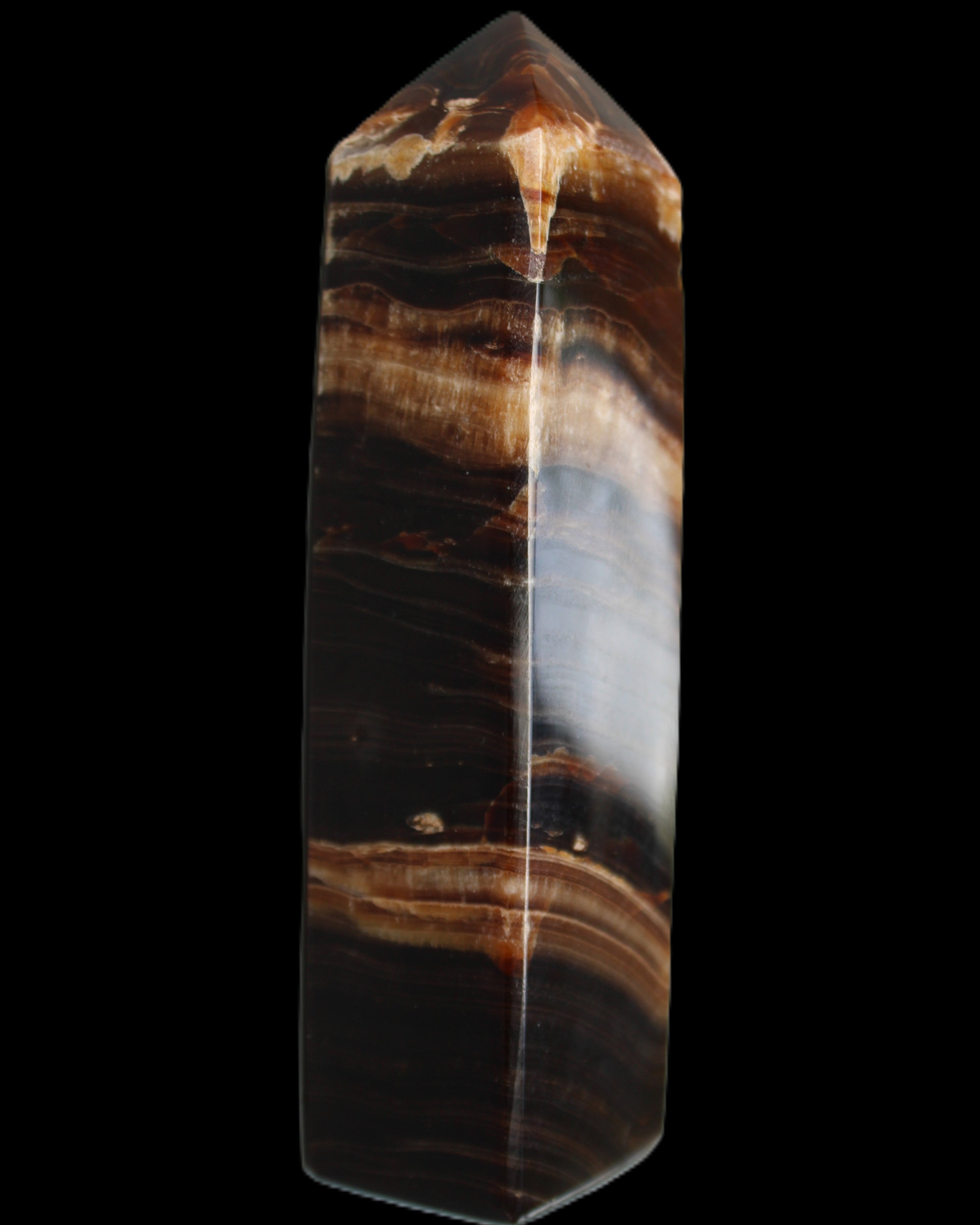 Chocolate Calcite obelisk 116*32mm 243g in sunlight - Rocks and Things Store