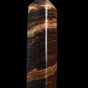 Chocolate Calcite obelisk 116*32mm 243g in sunlight - Rocks and Things Store