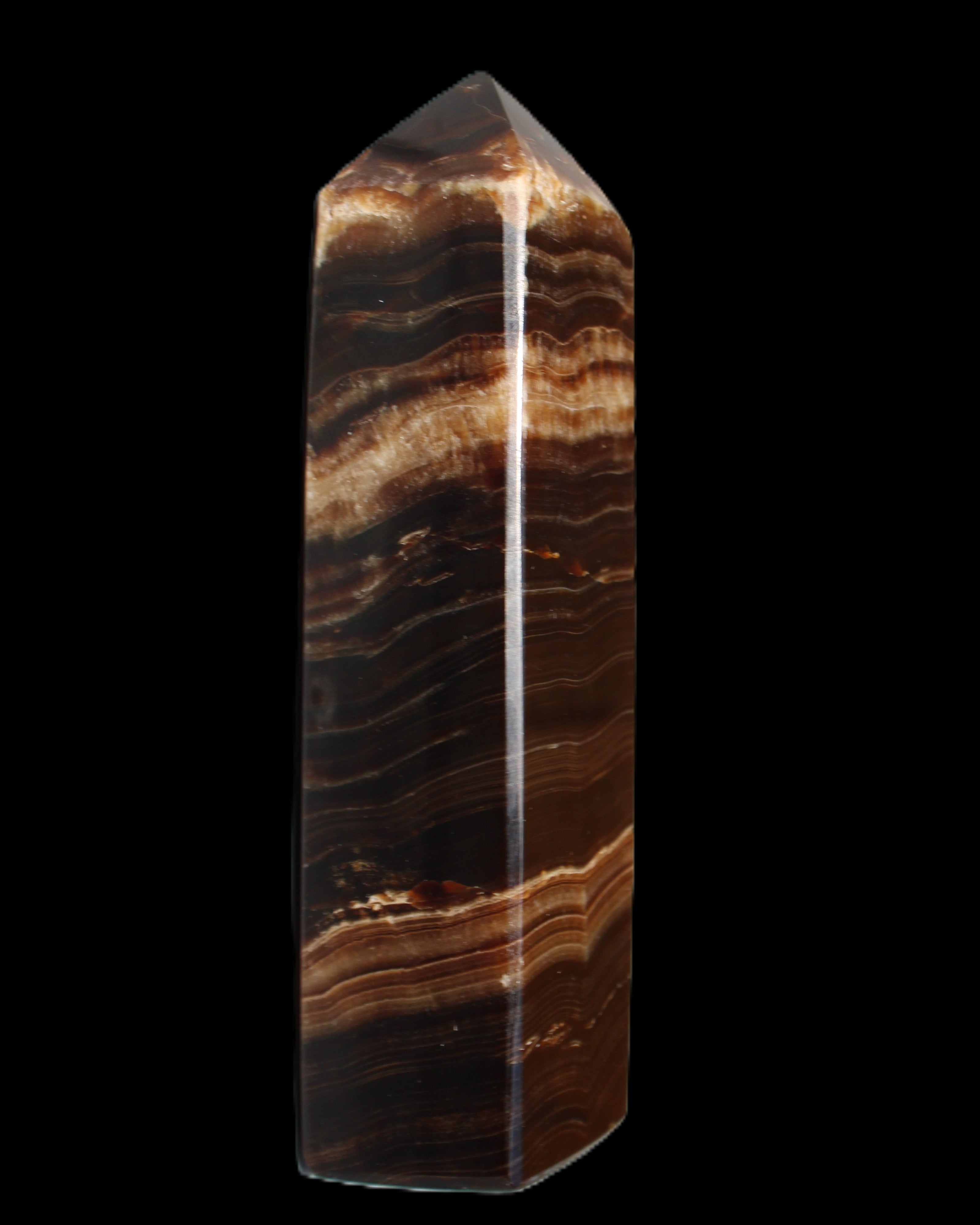 Chocolate Calcite obelisk 116*32mm 243g in sunlight - Rocks and Things Store