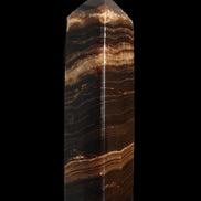 Chocolate Calcite obelisk 116*32mm 243g in sunlight - Rocks and Things Store