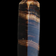 Chocolate Calcite obelisk 116*32mm 243g in sunlight - Rocks and Things Store