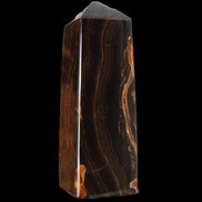 Chocolate Calcite obelisk 91*34mm 211g in sunlight - Rocks and Things Store
