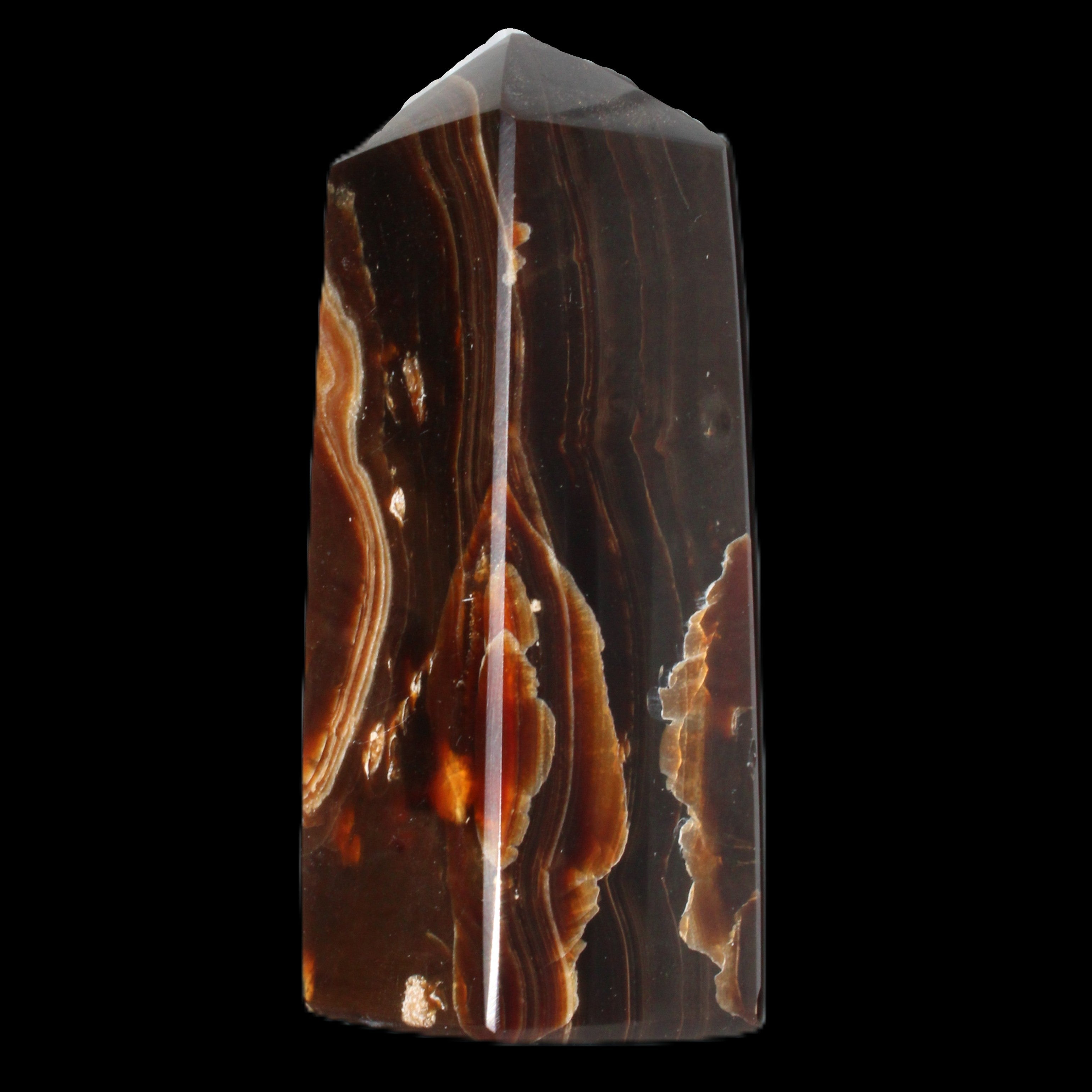 Chocolate Calcite obelisk 91*34mm 211g in sunlight - Rocks and Things Store