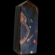 Chocolate Calcite obelisk 91*34mm 211g in sunlight - Rocks and Things Store