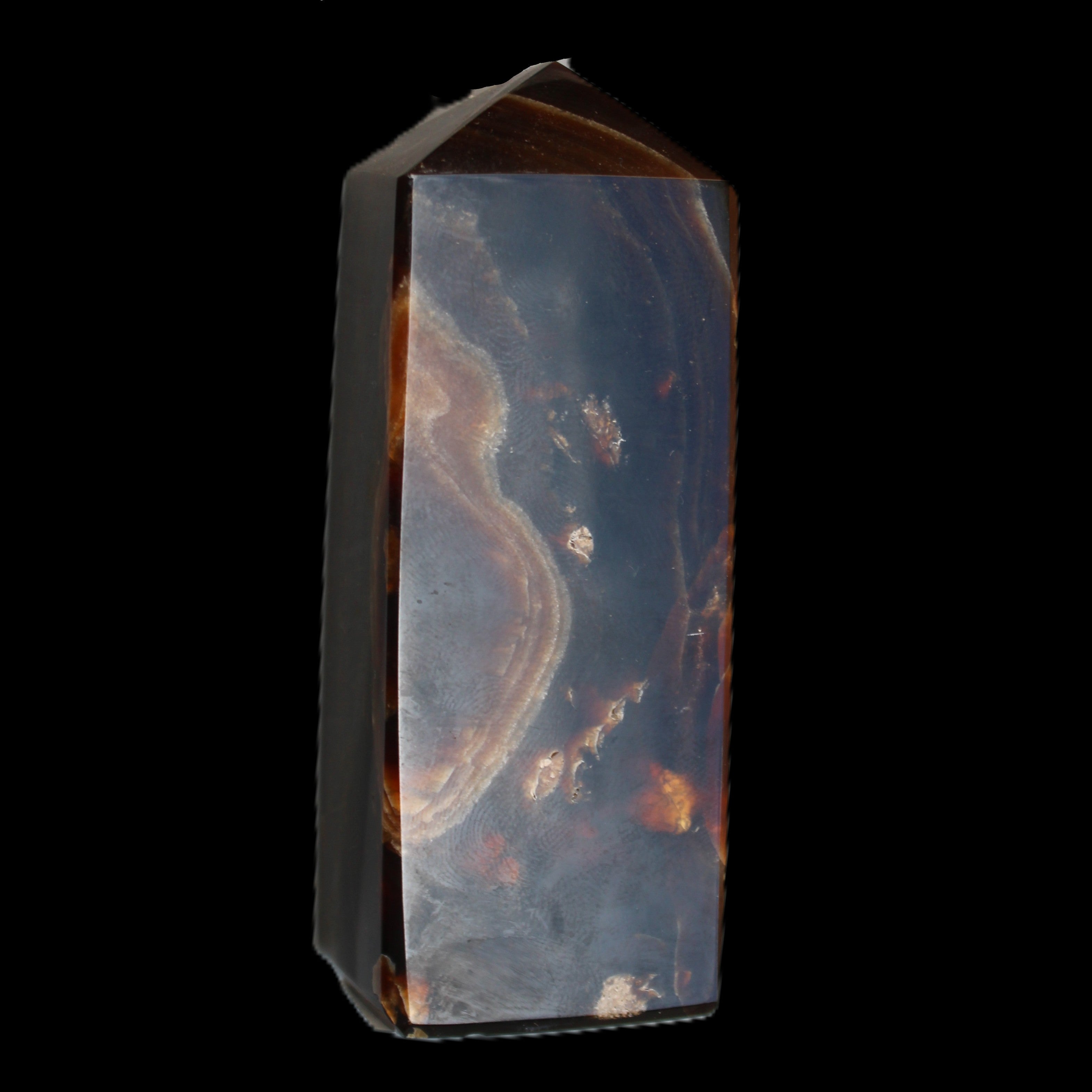 Chocolate Calcite obelisk 91*34mm 211g in sunlight - Rocks and Things Store