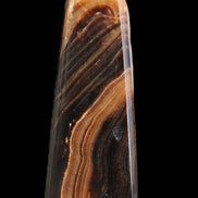 Chocolate Calcite obelisk 103*35mm 268g in sunlight - Rocks and Things Store