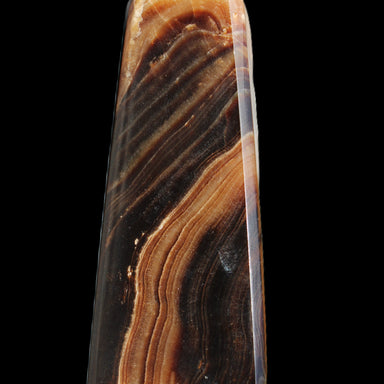 Chocolate Calcite obelisk 103*35mm 268g in sunlight - Rocks and Things Store