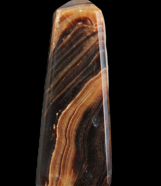 Chocolate Calcite obelisk 103*35mm 268g in sunlight - Rocks and Things Store