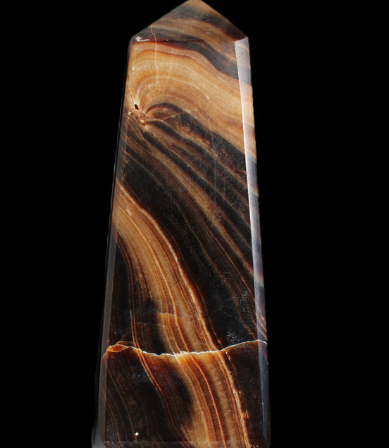 Chocolate Calcite obelisk 103*35mm 268g in sunlight - Rocks and Things Store