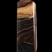 Chocolate Calcite obelisk 103*35mm 268g in sunlight - Rocks and Things Store