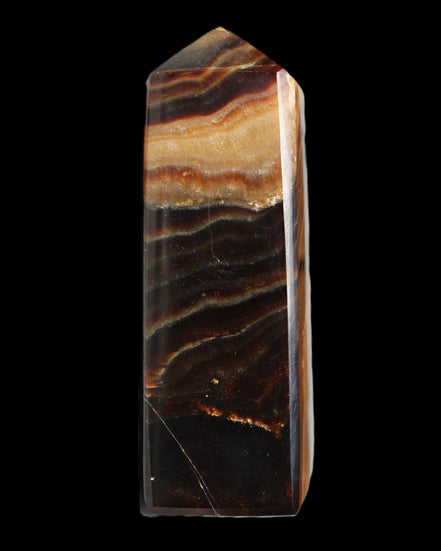 Chocolate Calcite obelisk 103*35mm 268g in sunlight - Rocks and Things Store