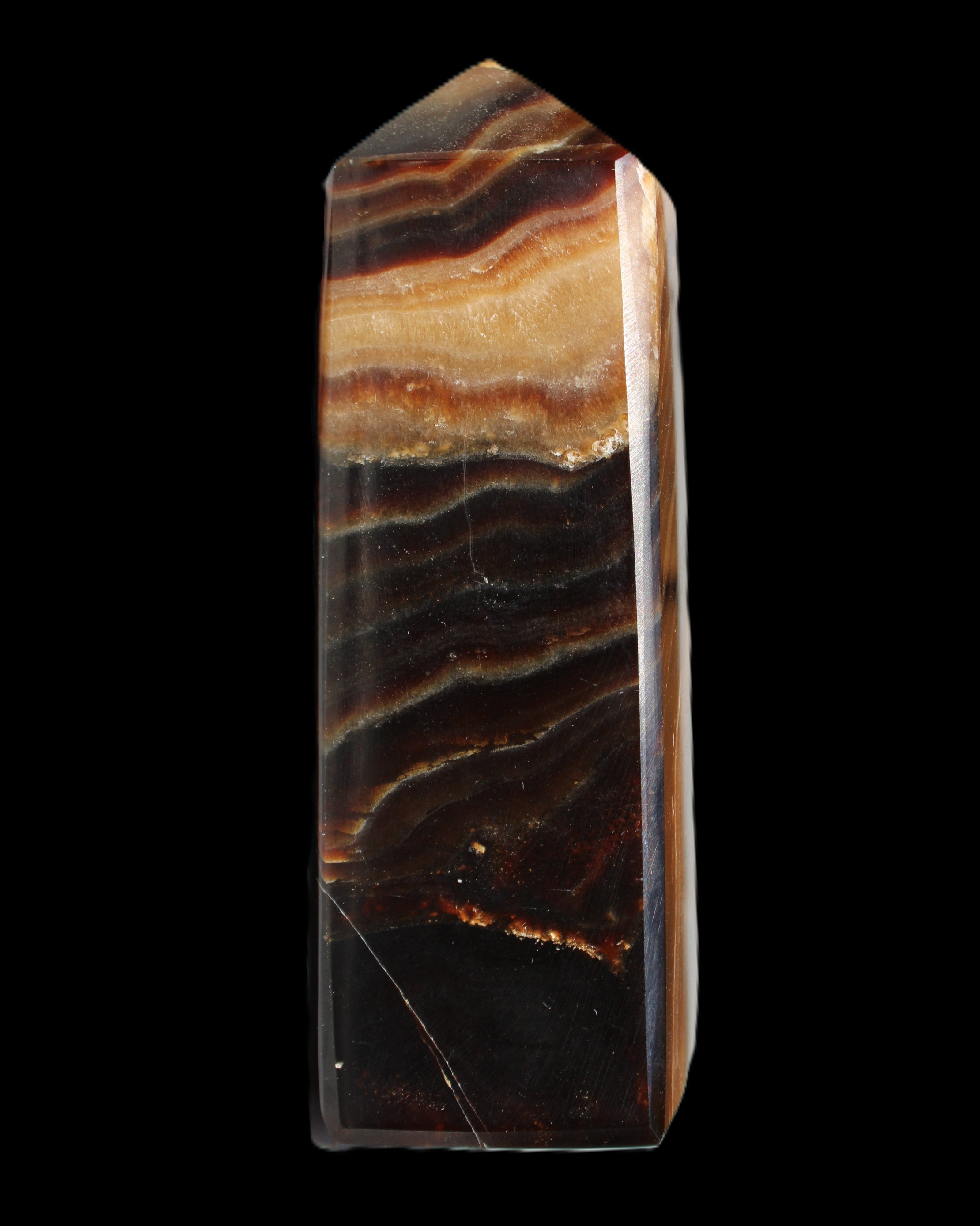 Chocolate Calcite obelisk 103*35mm 268g in sunlight - Rocks and Things Store