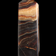 Chocolate Calcite obelisk 103*35mm 268g in sunlight - Rocks and Things Store